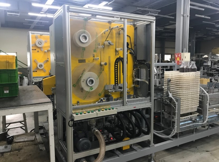   圖一、研發改良後之新一代全自動化製包機