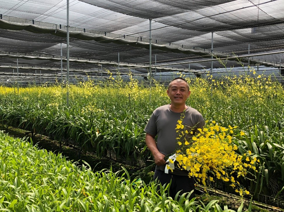 圖1、神農獎得主廖秉鋐跟他培育的文心蘭，成為2018臺中花博《讓世界看到臺灣的美好》宣傳亮點。